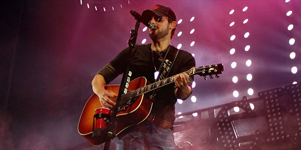 Image Of Eric Church Playing Guitar And Singing